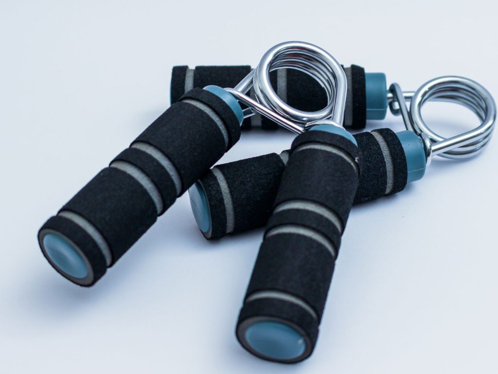 Close-up of foam handle hand grippers for enhancing grip strength during workouts. — Horizon Elliptical Coach Evaluate