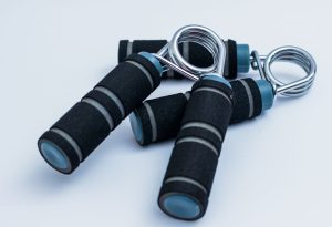Close-up of foam handle hand grippers for enhancing grip strength during workouts. — Horizon Elliptical Coach Evaluate