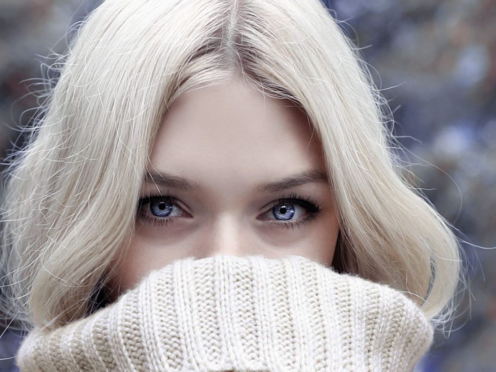 A close-up portrait of a blonde woman in winter attire, emphasizing her eyes. — Schwinn Windrigger Rowing Tools - Air Resista