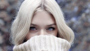 A close-up portrait of a blonde woman in winter attire, emphasizing her eyes. — Schwinn Windrigger Rowing Tools - Air Resista