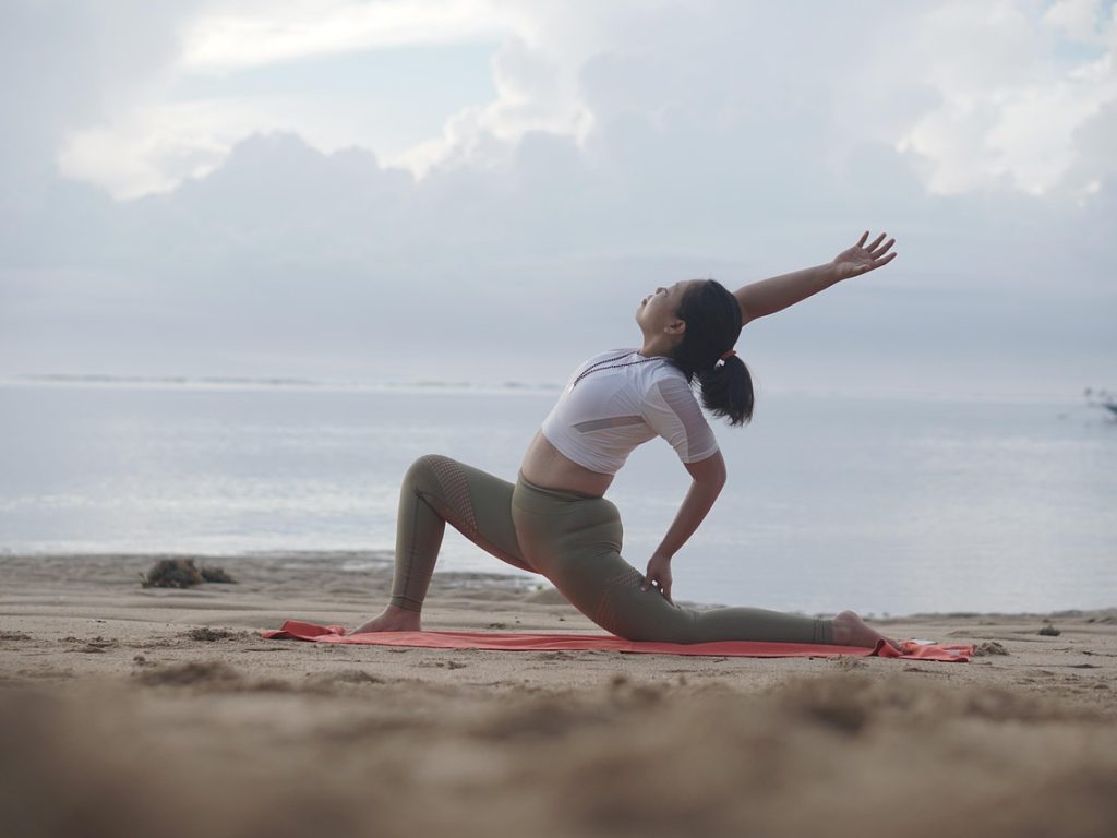 Yoga, woman, beach — Stepper Exercising Units - Professionals and Downsides